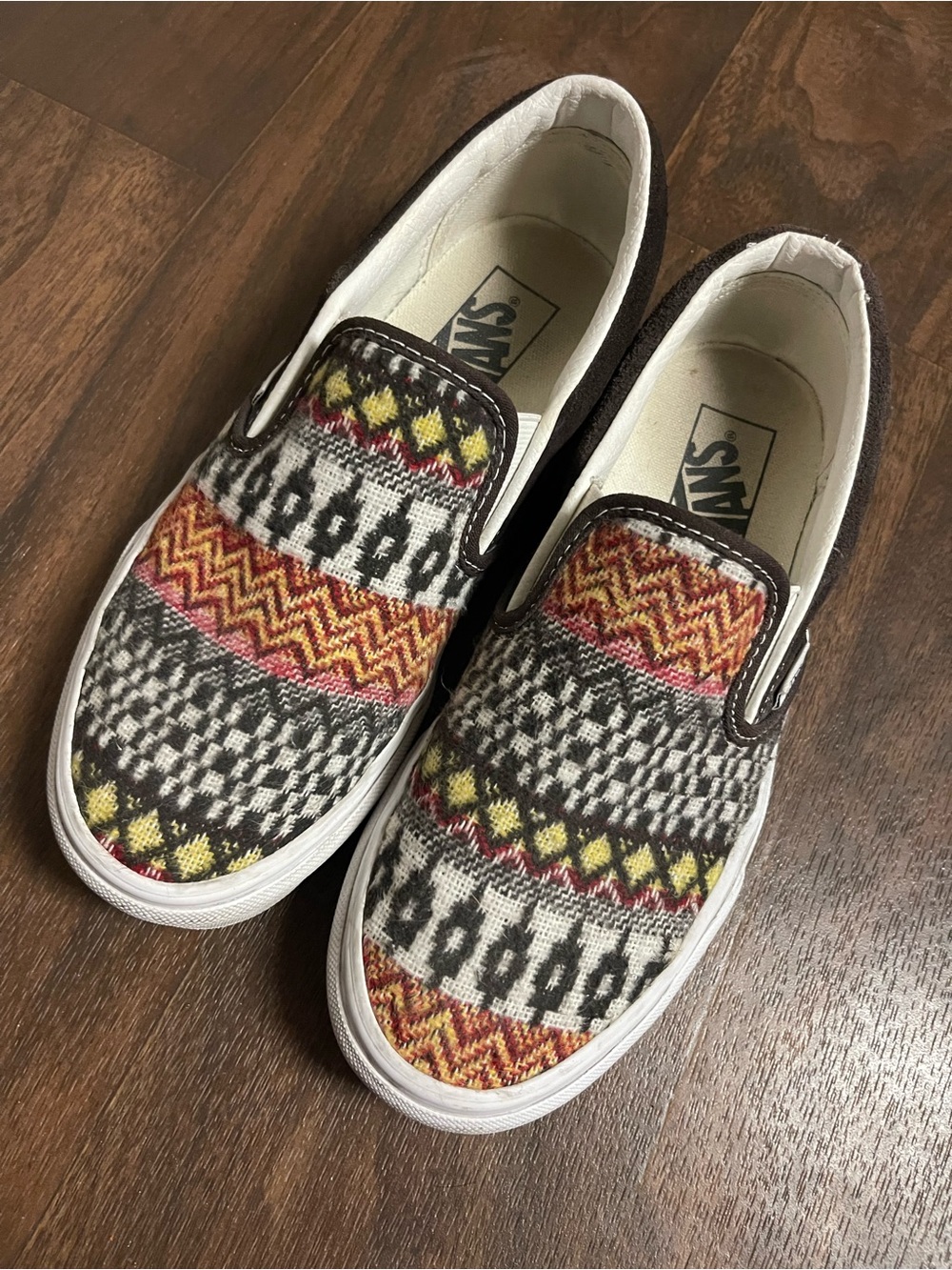 Vans Slip-On Sneakers in Black, White, Yellow, Red and Orange Pattern